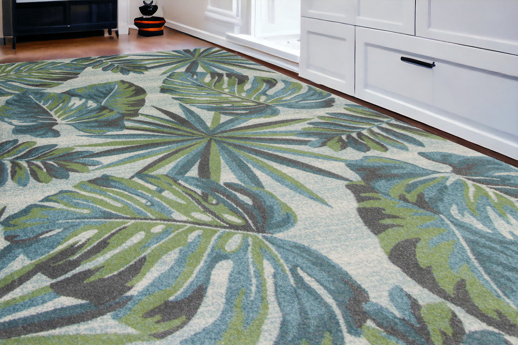 5' X 8' Teal Or Green Tropical Leaves Indoor Area Rug