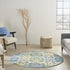 6' X 9' Ivory And Blue Floral Indoor Outdoor Area Rug