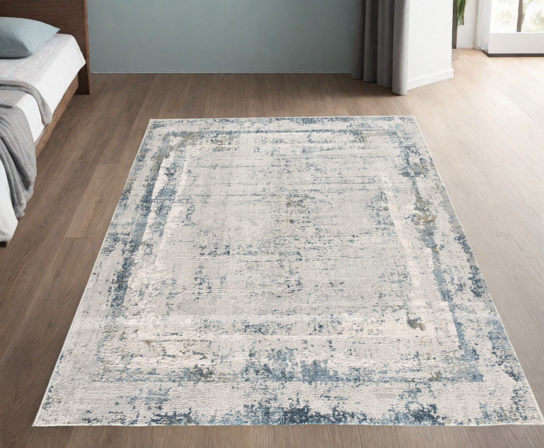 4’ X 6’ Ivory And Blue Abstract Distressed Area Rug