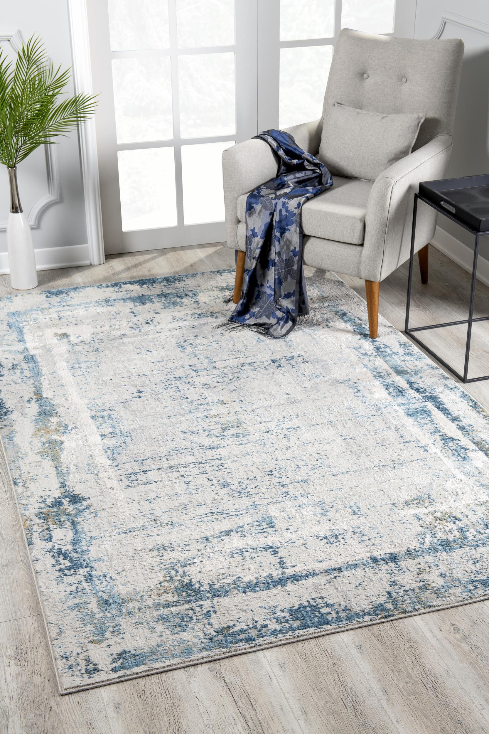 4’ X 6’ Ivory And Blue Abstract Distressed Area Rug