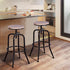 Set of Two 30" Natural And Black Steel Swivel Backless Bar Chairs