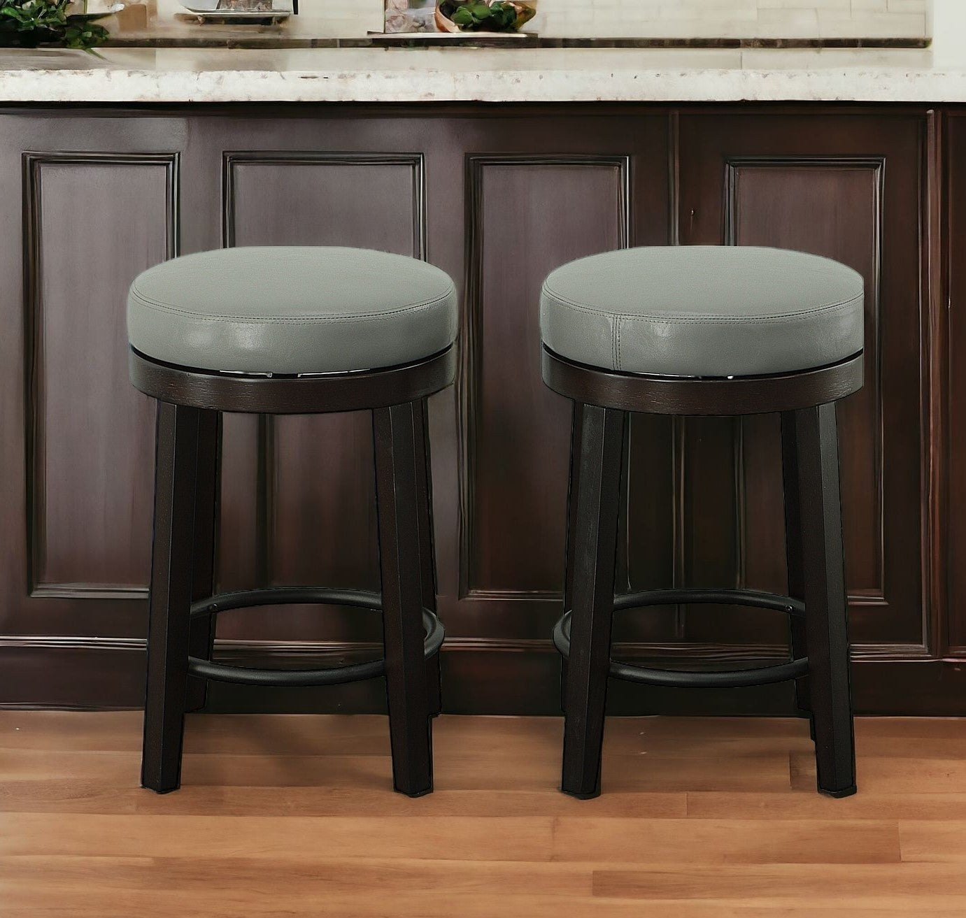 Set of Two 24" Gray And Espresso Faux Leather And Solid Wood Swivel Backless Counter Height Bar Chairs