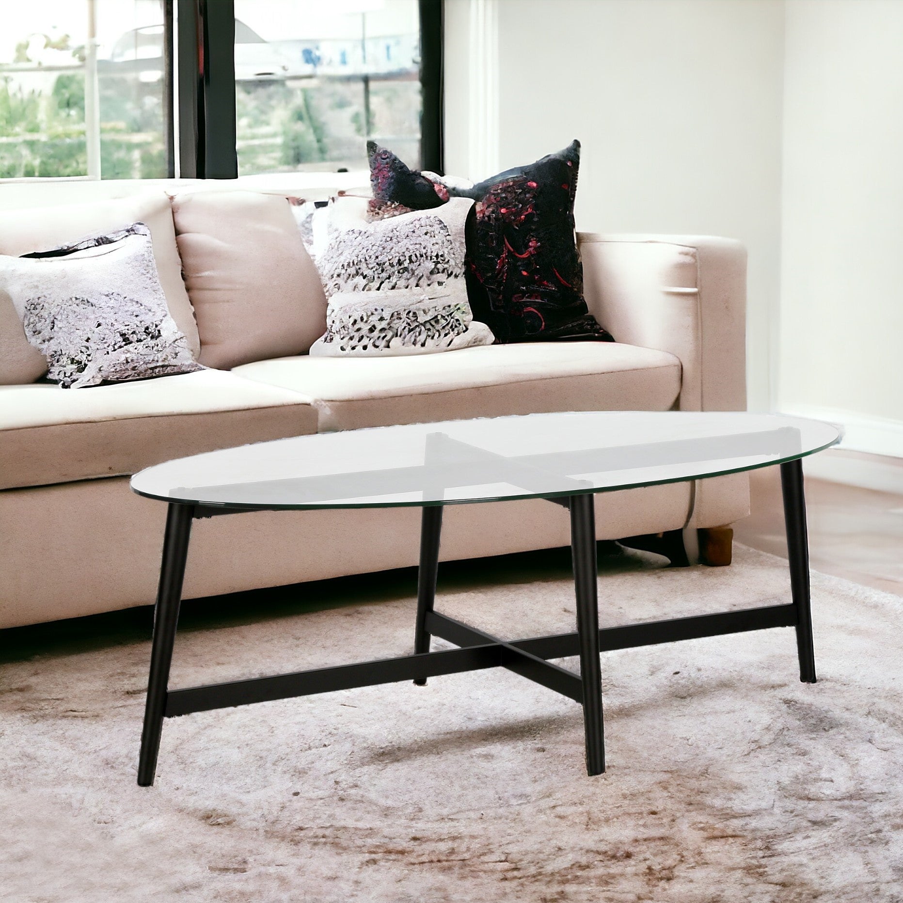 50" Clear And Black Glass And Steel Oval Coffee Table