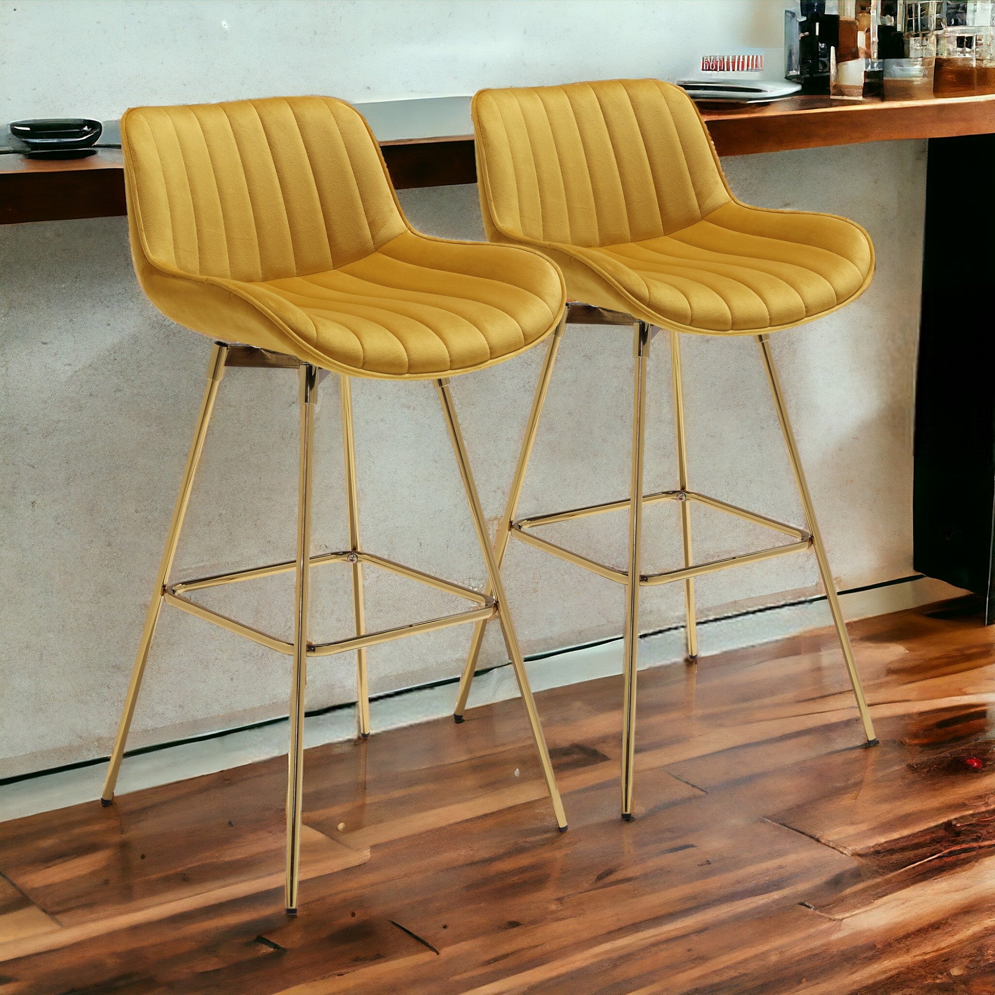 Set of Two 29" Yellow And Gold Velvet And Metal Swivel Low Back Bar Height Bar Chairs