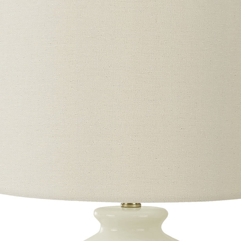 26" Gold and Ivory Ceramic Urn Table Lamp With Cream Drum Shade